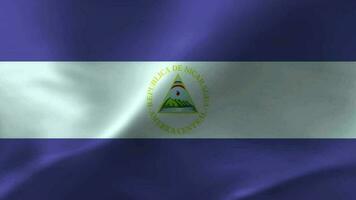 Nicaragua Flagge winken Textil- texturiert Hintergrund. nahtlos Schleife Animation video