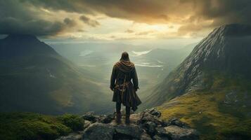 AI Generative A hooded warrior man stands atop a rugged mountain peak photo