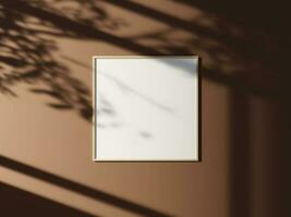 Minimal picture poster frame mockup on the wall with window shadow and leaves photo