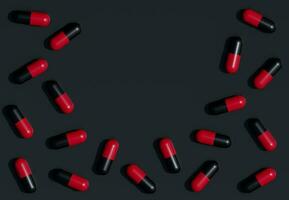 Black and Red tablet pills on Black background. 3D Rendering. Medical Harmful Concept. Dangerous drugs. Empty space for text. photo