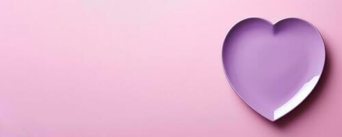 Vivid heart plate isolated on background with a copy space, top view photo