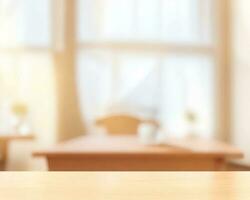 Wooden table looking out to a defocussed kitchen room with sun shining in the window photo