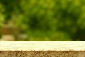 White marble top looking out to a defocussed garden background photo