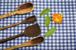 Rustic wooden spoons on the table. photo