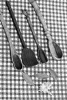 Rustic wooden spoons on the table. photo