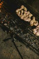 Cow bowels presented on a wooden board with ingredients, ready to grill photo