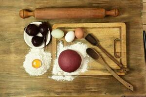 Purple dough bun for noodles with ingredients on the table. photo