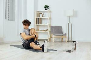 man indoor activity fitness dumbbells training home health gray sport lifestyle photo