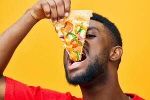 man delivery food hold pizza habit guy black background smile fast happy food photo