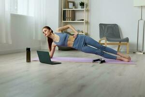 woman mat health laptop training lifestyle video fit home yoga lotus photo