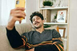 Communication man message selfie phone home lifestyle typing photo