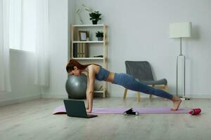 woman yoga gray video home lifestyle lotus health mat laptop training photo