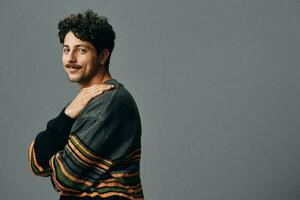 Man hipster sweater face fashion portrait copyspace trendy guy handsome studio smile photo