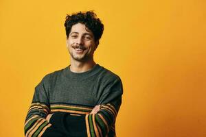 Man student thinking sweater happy portrait trendy orange serious model smile cheerful fashion background photo