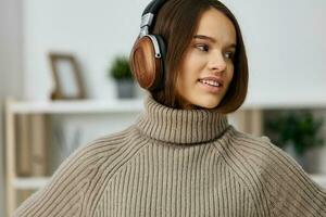 home woman music happy student earphones caucasian young indoor apartment headphones photo