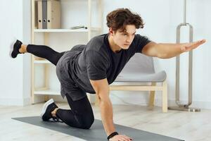 man indoor healthy training health lifestyle activity home house sport stretching photo