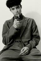 Man sitting black portrait white stylish smoking hipster fashion thoughtful cigarette student and photo