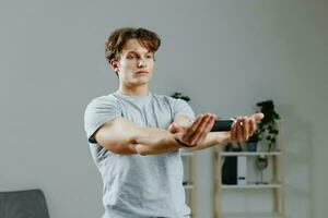 dumbbells man home activity training wellness lifestyle sport gray health indoor photo