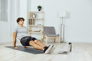dumbbells man sport gray activity tutorial health training lifestyle home indoor photo