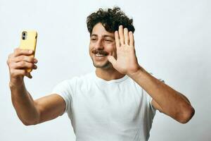 Man hipster white lifestyle message using phone portrait young online technology t-shirt photo