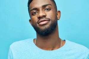 man guy fashion smiling expression african blue black background isolated american smile portrait photo