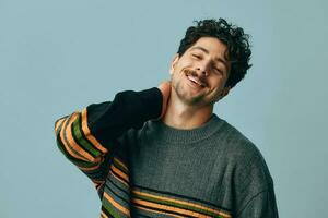 Man standing hipster fashion studio sweater face hand copyspace portrait trendy handsome smile cool photo