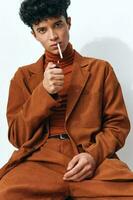 Man portrait smoking fashion cigarette sitting photo