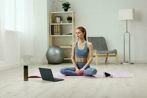health woman body training lifestyle mat lotus home video yoga laptop photo