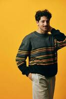 Trendy man portrait happy background orange sweater smile fashion photo