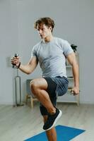 man training lifestyle dumbbells activity gray indoor apartment sport health home photo