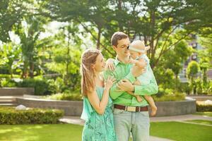 Family playing with the child together photo