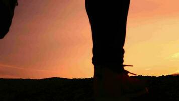 Slow motion. Men practice trail running in the evening. Silhouette of man running video