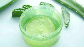 aloe vera gel in a jar with green leaves video