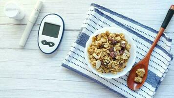diabetic measurement tools and healthy breakfast cereal in a bowl on table video