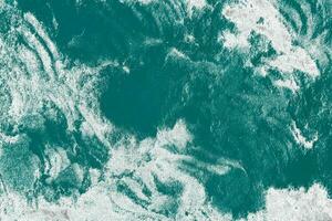 lujo ligero agua y azul Oceano en encimeras granito textura foto
