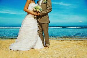 Newly married couple on the beach photo