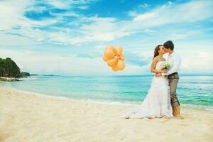 Newly married couple on the beach photo