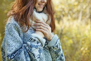 female hands over the sweater photo