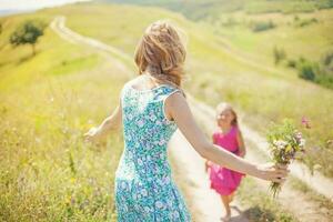 Mother and daughter in the park photo