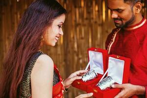 a man and woman in traditional Indian attire photo