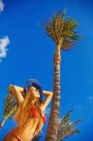 Beautiful young woman on the beach photo