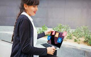 Businesswoman with laptop photo