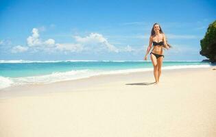 Beautiful woman on the beach photo