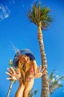 Beautiful young woman on the beach photo