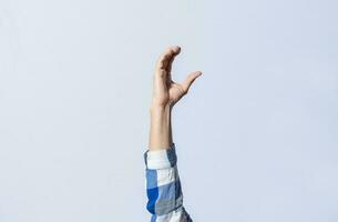 Hand gesturing the letter C in sign language on isolated background. Man hand gesturing letter C of alphabet isolated. Letters of the alphabet in sign language photo