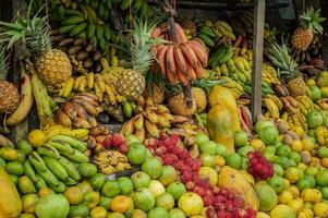 Shelf of many fresh fruits, fresh fruit stall, concept of fruits and healthy food, sale of various fruits photo