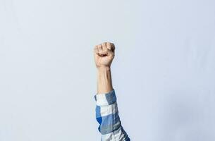 Hand gesturing the letter E in sign language on isolated background. Man hand gesturing letter E of alphabet isolated. Letters of the alphabet in sign language photo