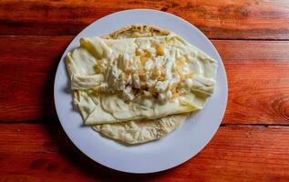 Top View of traditional Cheese with Pickled Onion, Traditional cheese dish with pickled onion and cream. Concept of typical foods of latin america photo