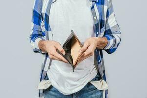 Concept of frustrated people without money. Hands showing an empty wallet, Hands of people showing an empty wallet to the camera, Person with economic problems showing an empty wallet photo