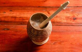 Nicaraguan cocoa drink in artisan jicara. Nicaraguan cocoa drink served in a traditional gourd. Concept of traditional drinks from Nicaragua and latin america photo